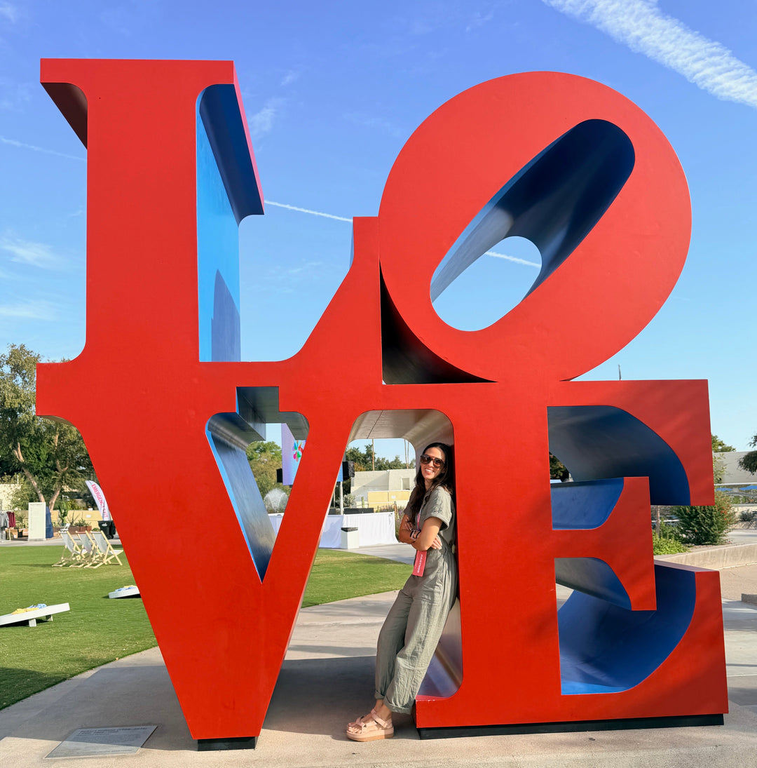 Erica Sara in front of LOVE statue in Scottsdale