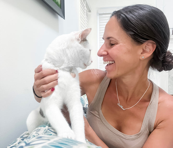 Erica Sara wearing custom name necklace with her cat